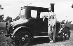 Letter_Home_12.21.1929/1926_Model_ T_Ford/Bliley_F.D._Standing_by_1926_Ford-LRG.jpg